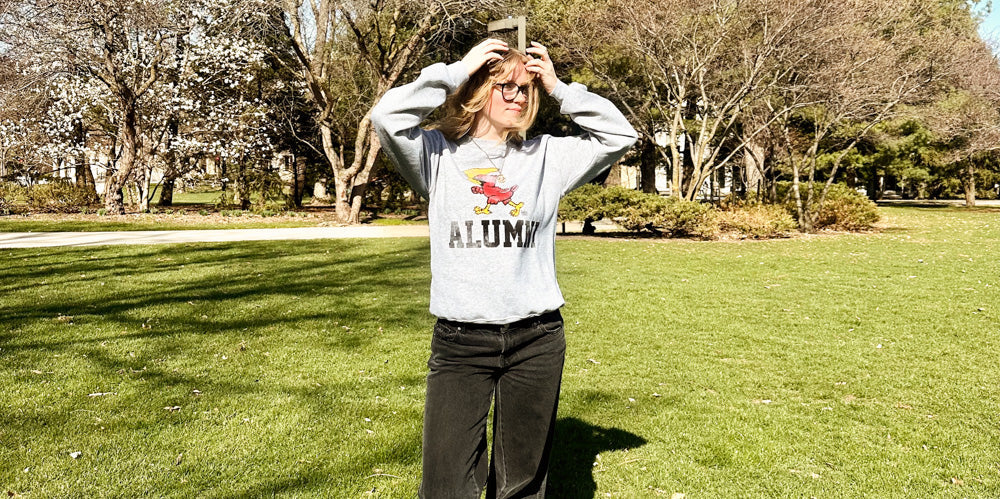 girl wearing an Iowa State Cyclones alumni crewneck
