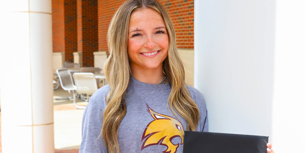 girl wearing a Texas State Bobcats alumni tshirt