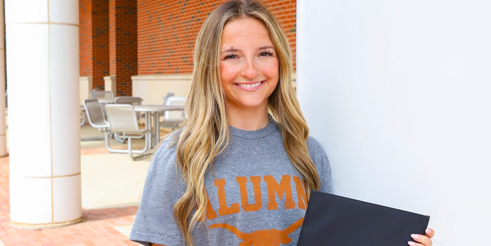 girl wearing a UT Alumni tshirt