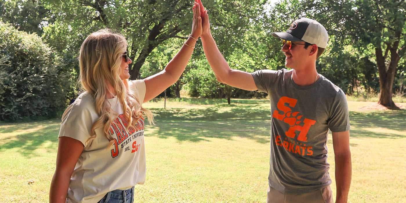 Sam Houston students giving a high five wearing Barefoot