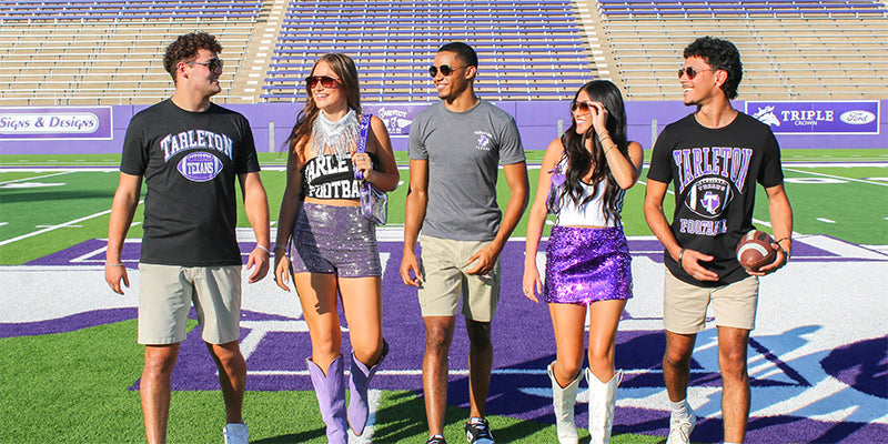 college students wearing Tarleton game day gear on a football field