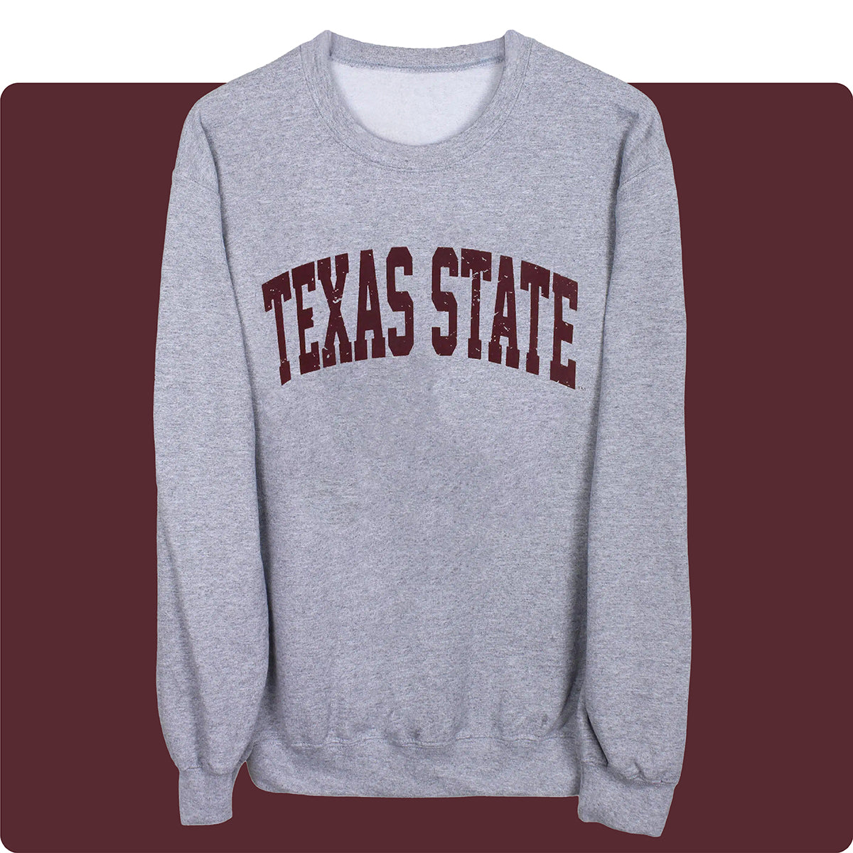 Grey unisex Texas State University crewneck with maroon lettering on a maroon background