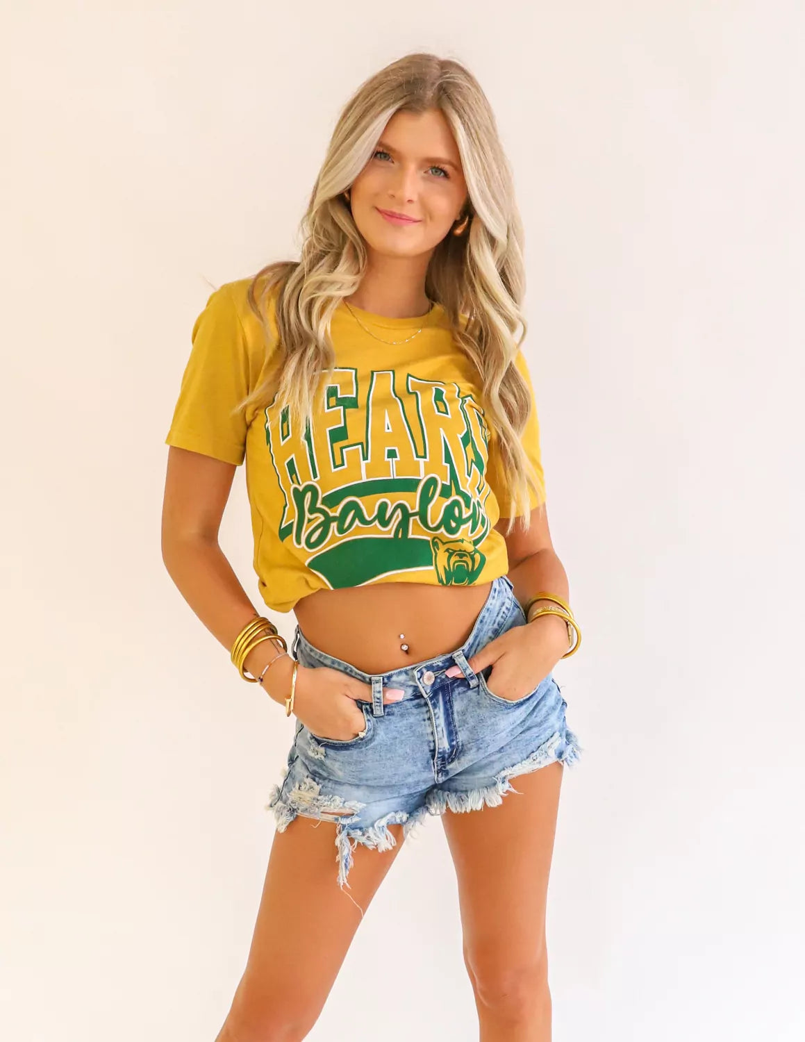 Baylor Bears student wearing mustard BU apparel against a white background.