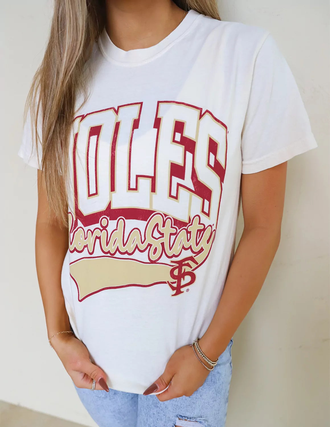 Detail view of a FSU Seminoles student wearing white Florida State University apparel.