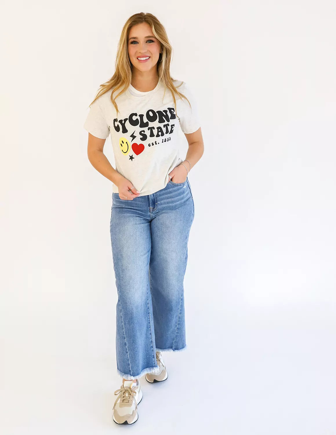Iowa State University student wearing cream heather ISU apparel against a white background.