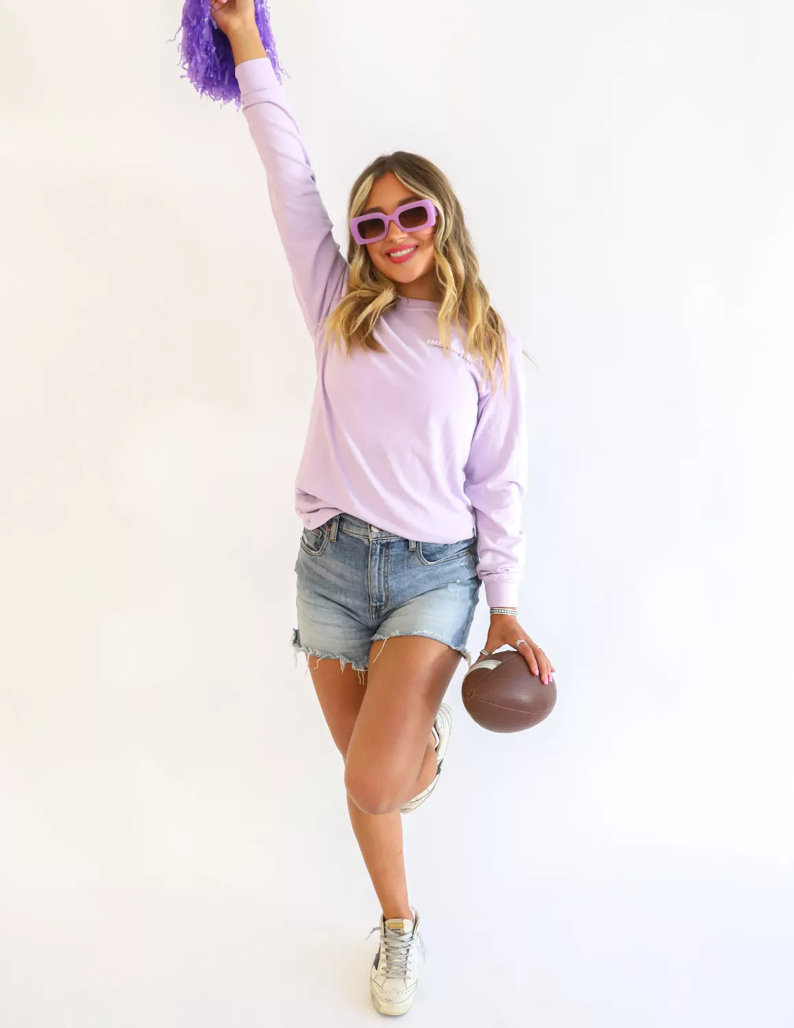 Tarleton State University student wearing light purple TSU apparel against a white background.