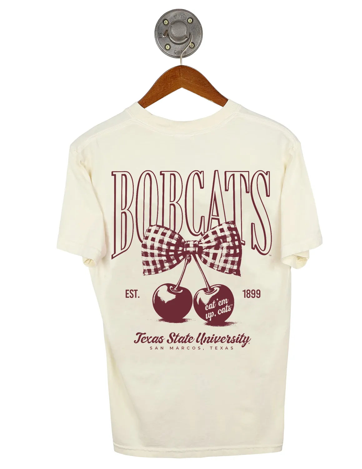 Ivory Texas State University unisex Comfort Colors t-shirt that features a cherry and bow graphic with maroon lettering.