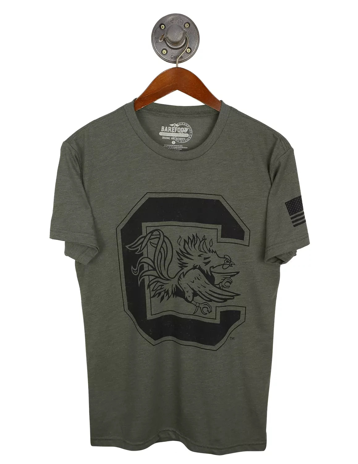 Military green unisex University of South Carolina t-shirt featuring a Gamecocks logo in the center with an American flag on the sleeve.
