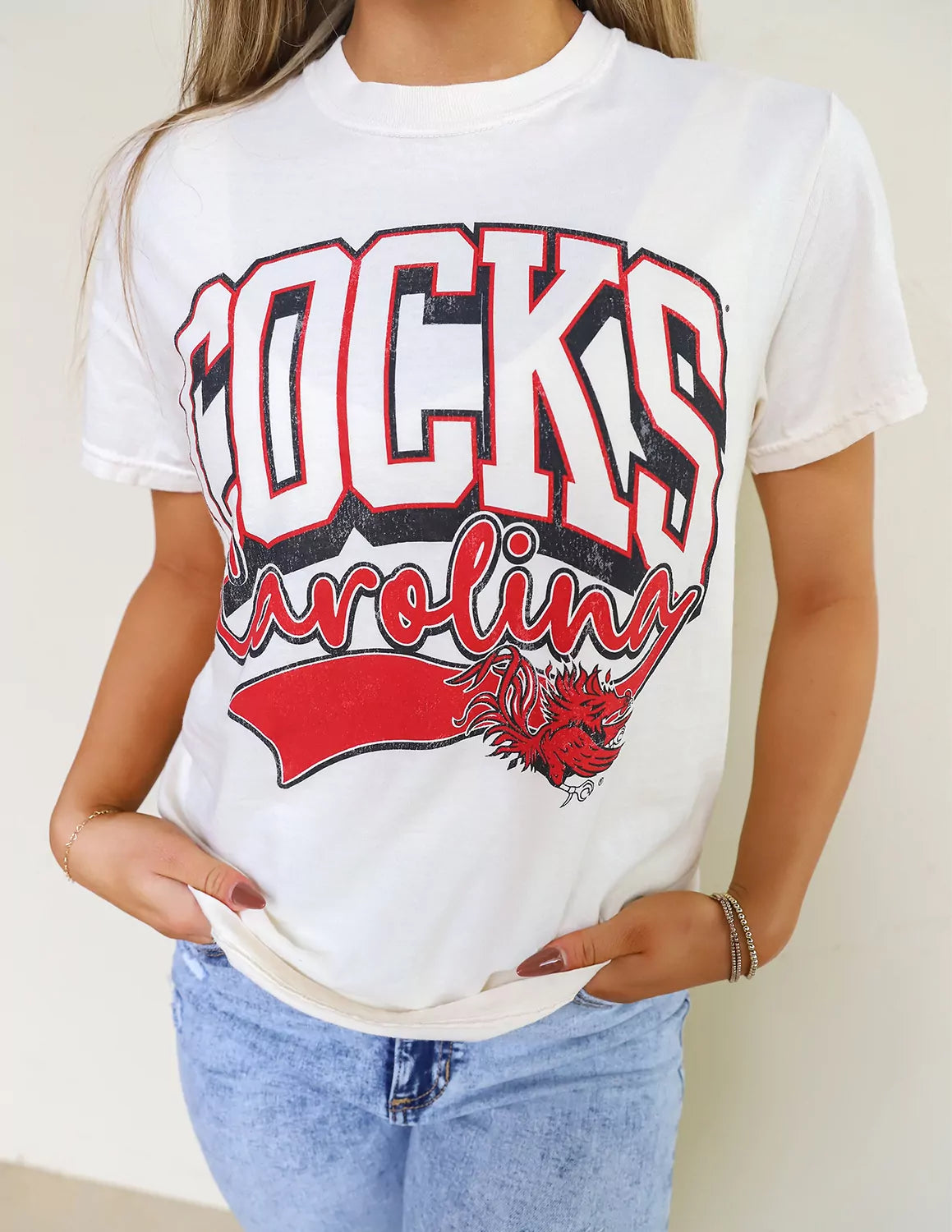 Detail view of a USC Gamecocks student wearing white University of South Carolina apparel.