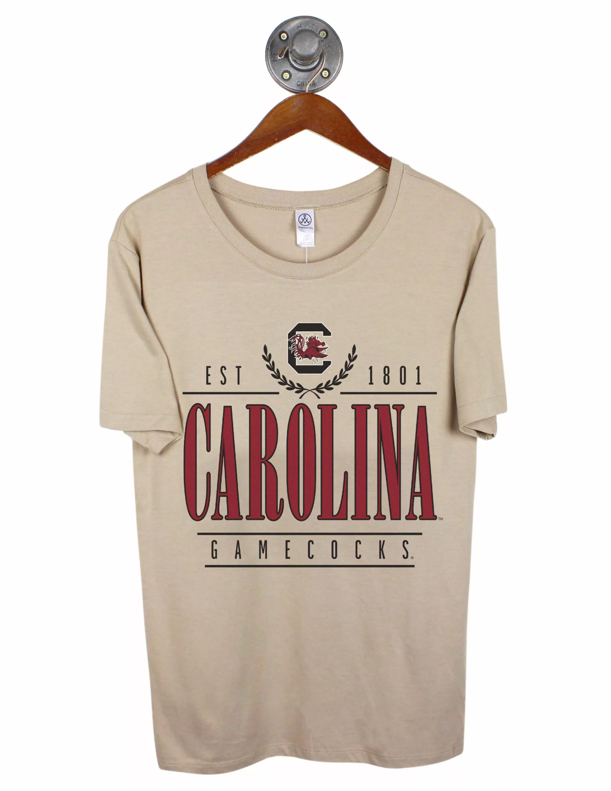 Tan University of South Carolina unisex t-shirt featuring a USC logo at the top center with black and garnet lettering underneath.