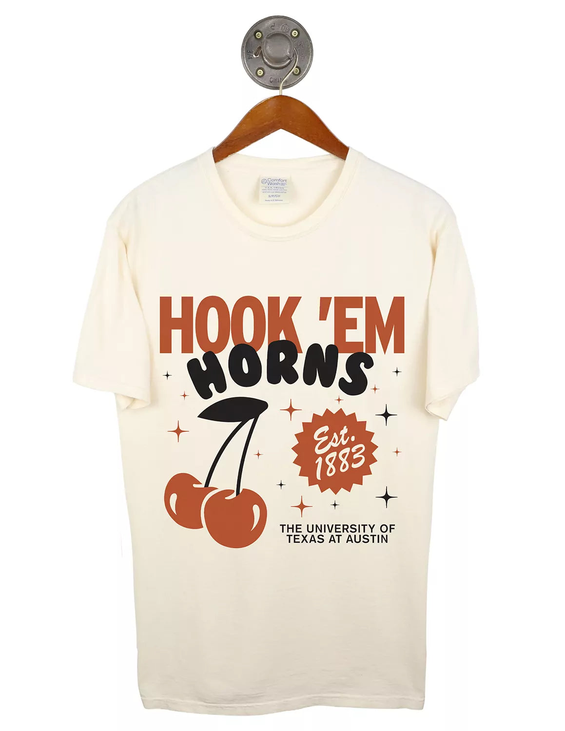 Cream unisex University of Texas at Austin t-shirt that features a graphic of two cherries with a stem, burnt orange and black lettering, and small black star graphics.