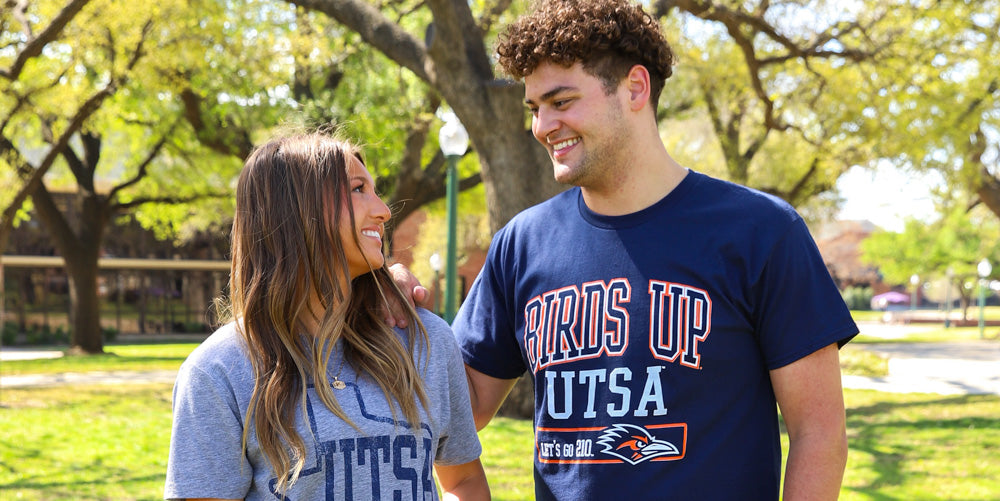 a guy and girl wearing UTSA gear