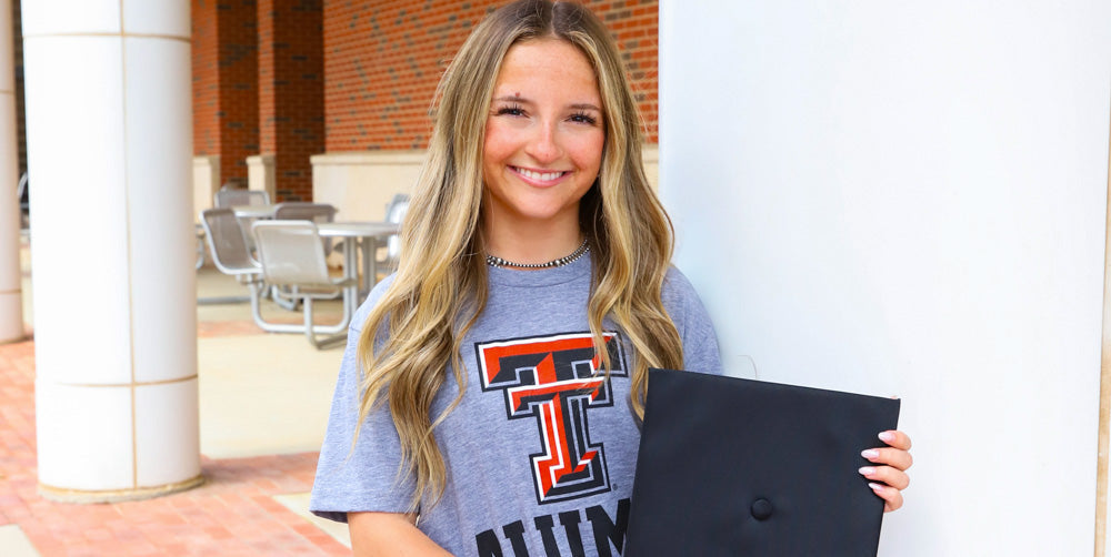 girls wearing a Texas Tech alumni tshirt