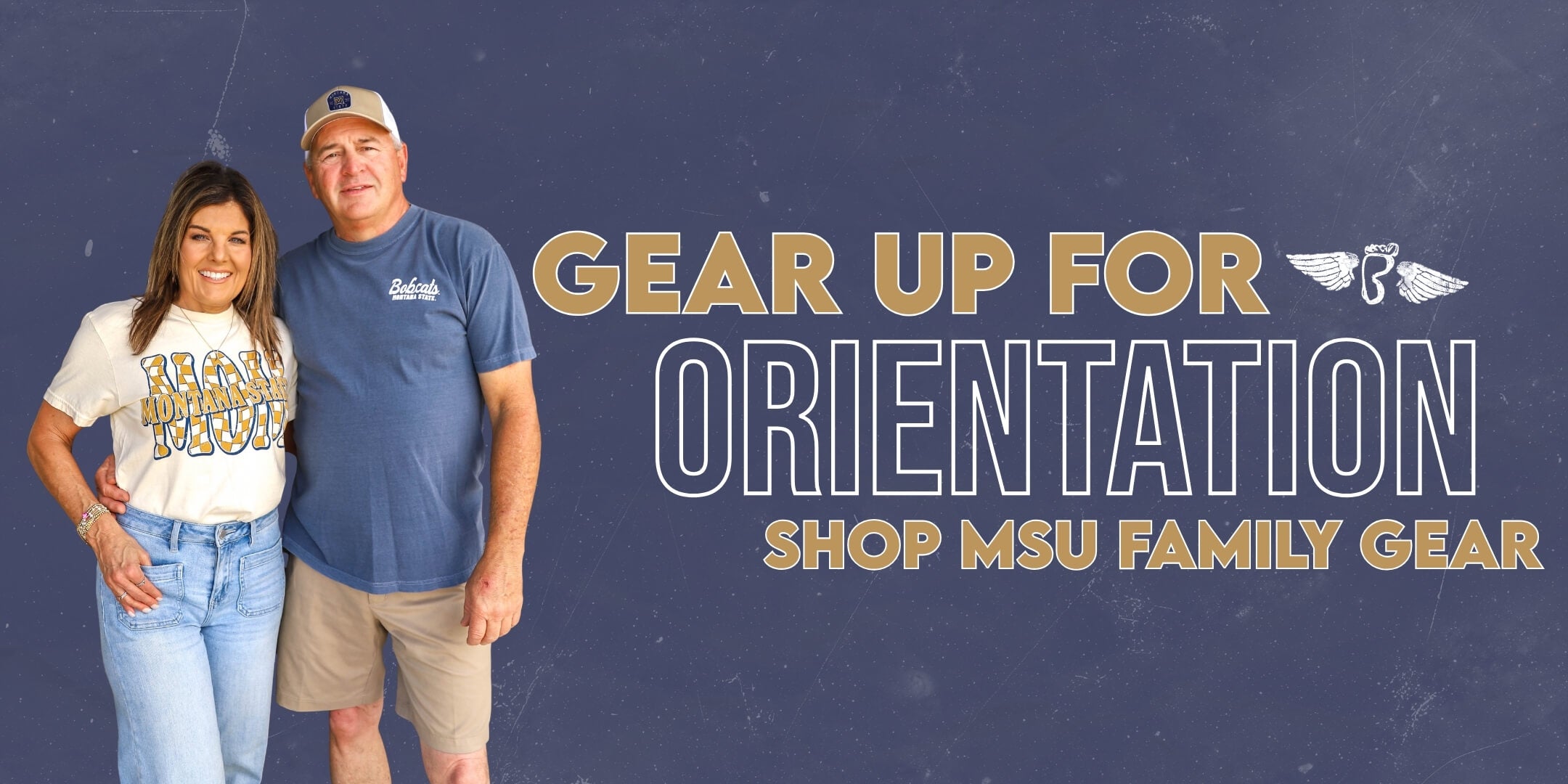 Smiling woman and man in casual wear pose against a dark blue background. Text reads, "Gear Up for Orientation. Shop MSU Family Gear."