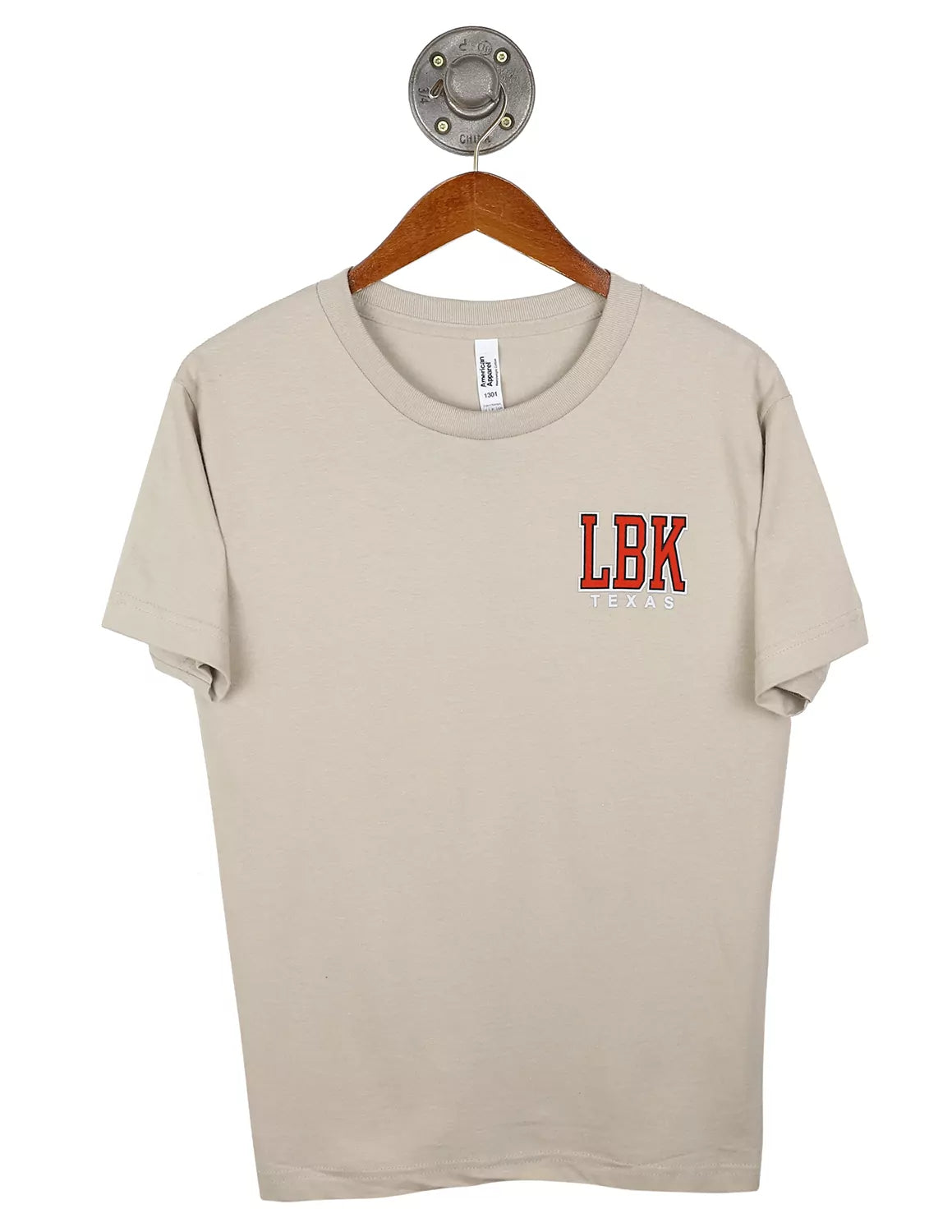 Sand unisex Lubbock, Tx t-shirt with a left chest design with "LBK" lettering in red, black, and white. 