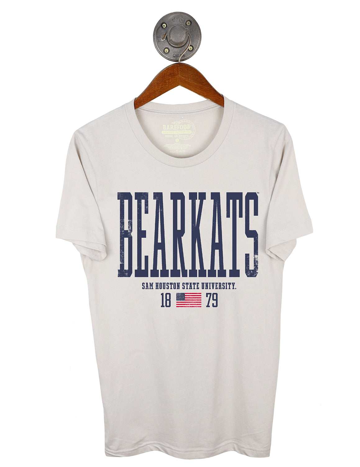 Dust Sam Houston State University unisex short-sleeve t-shirt that features blue lettering with an American flag graphic underneath. 