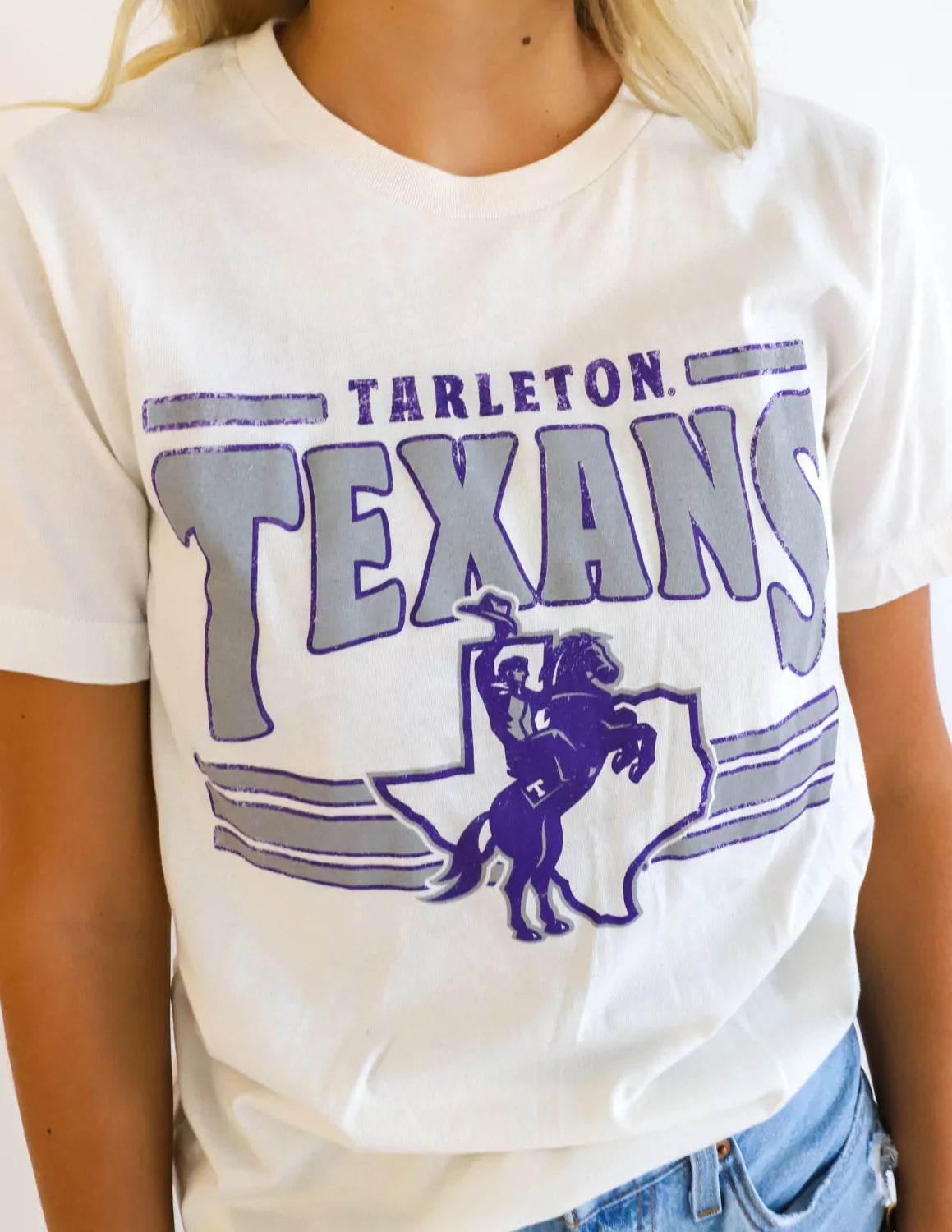 TSU Texan student wearing white Tarleton State University apparel. 