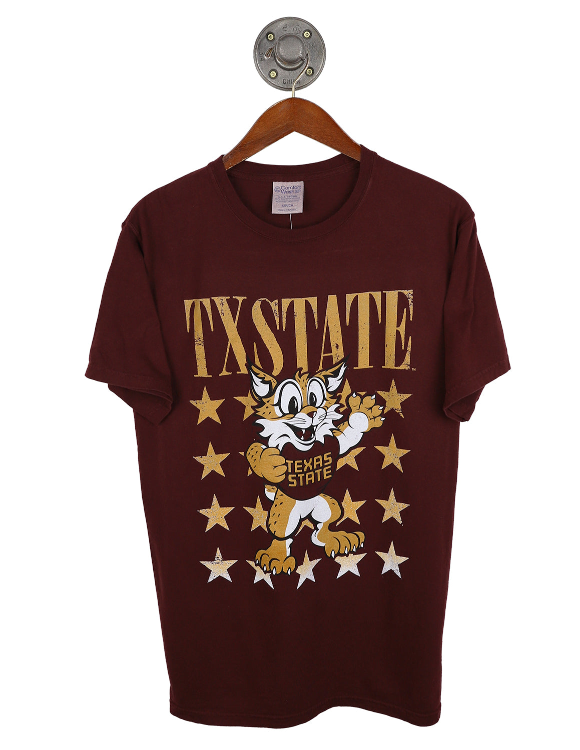 Maroon Texas State University unisex short-sleeve t-shirt featuring "TXSTATE" in gold lettering above a Bobcat mascot surrounded by a star pattern. 