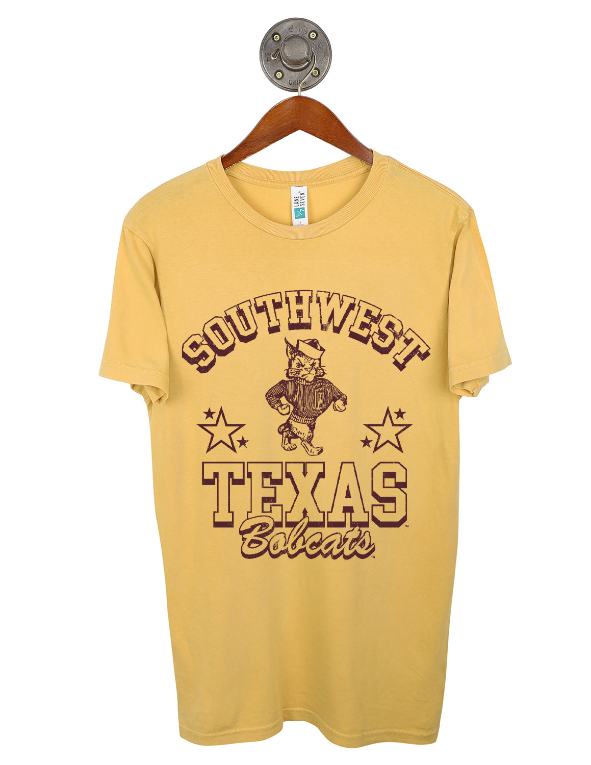 Mustard unisex Texas State University t-shirt featuring a Bobcat logo and maroon stars and lettering. 
