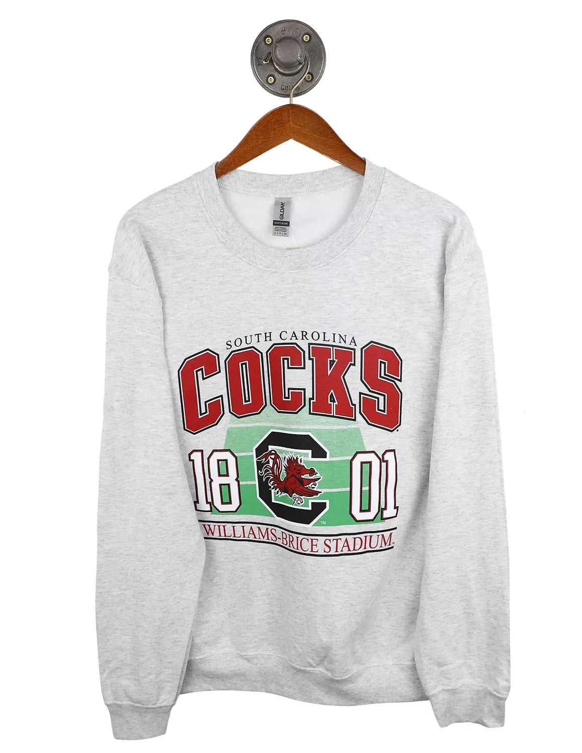 Ash grey University of South Carolina crewneck sweatshirt featuring "South Carolina Cocks" text in red large lettering with a USC block C logo and a Gamecock logo in the middle. 